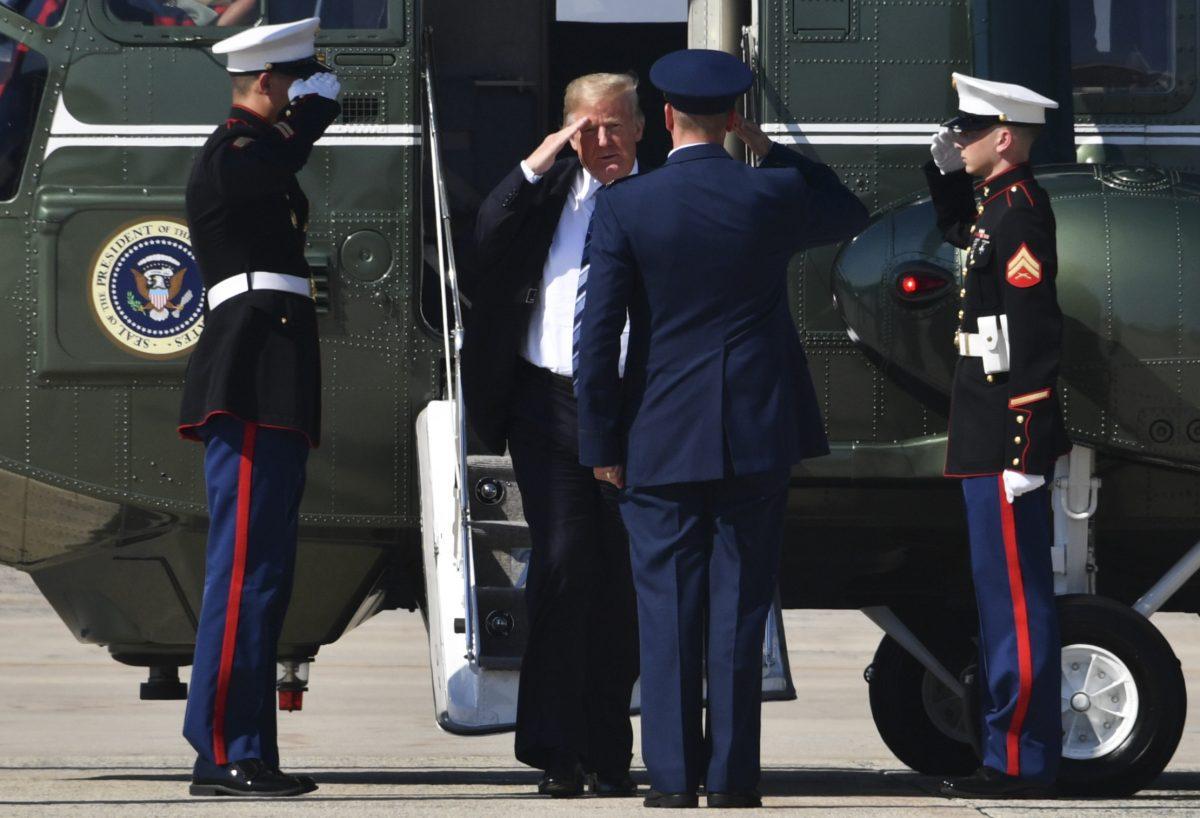President Donald Trump salutes before boarding Air Force One at Joint Base Andrews, Md., on Sept. 6, 2018. Trump is heading to Billings, Mont., for a fundraiser and rally. (NICHOLAS KAMM/AFP/Getty Images)