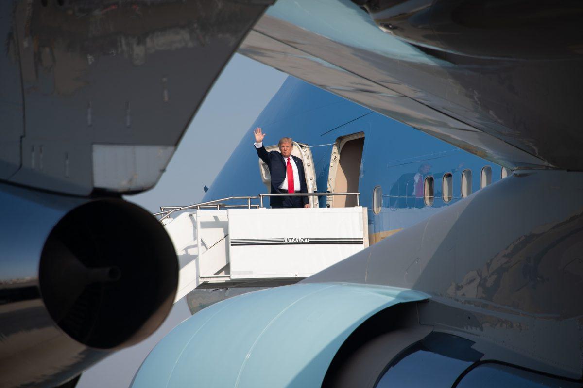 President Donald Trump boards Air Force One as he departs from Billings Logan International Airport in Billings, Mont., on Sept. 7, 2018. Trump travels to Fargo, N.D., to speak at a Joint Fundraising Committee. (NICHOLAS KAMM/AFP/Getty Images)