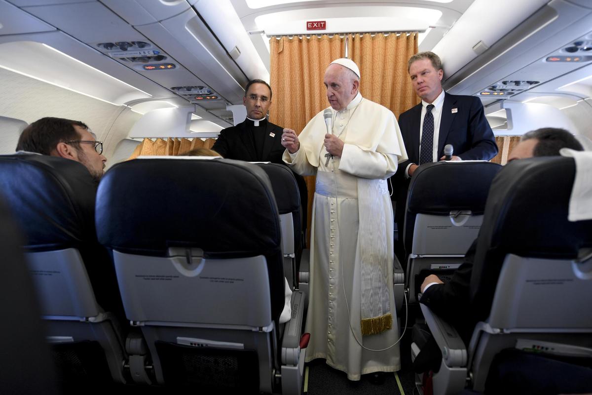 Pope Francis talks with journalists aboard a plane, at the end of his visit to Geneva for the 70th anniversary of the World Council of Churches on June 21, 2018. (CIRO FUSCO/AFP/Getty Images)