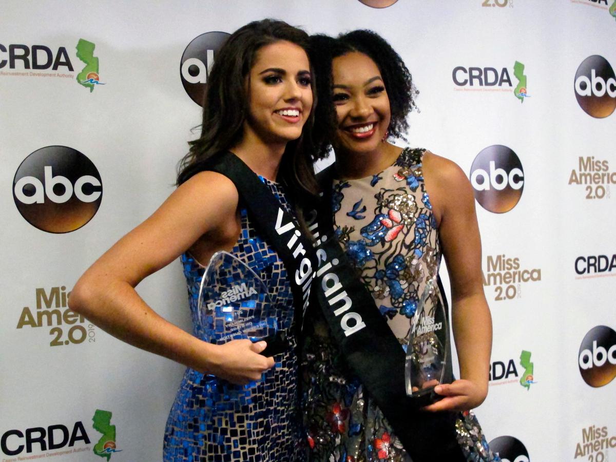Miss Virginia Emili McPhail, left, won the onstage interview portion and Miss Louisiana Holli' Conway, right, won the talent portion of the second night of preliminary competition in the Miss America pageant in Atlantic City N.J. on Thursday Sept. 6, 2018. (Wayne Parry/AP Photo)