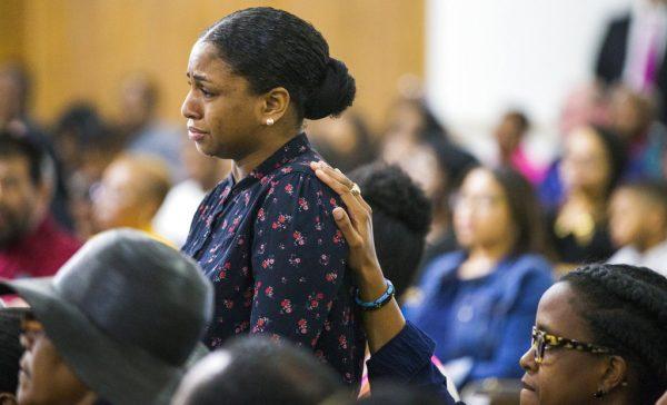Cynthia Johnson, Botham Jean's girlfriend, stands up as she is comforted by another churchgoer during a prayer service for Jean at the Dallas West Church of Christ on Sept. 9, 2018 in Dallas. (Shaban Athuman/The Dallas Morning News/AP)