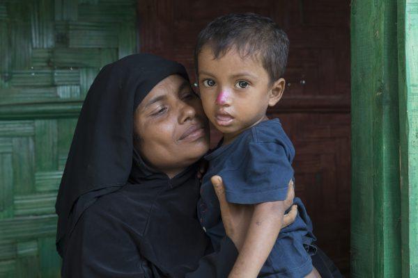 Rehena Begum, 35, and son Jamal Hussain, 2, pose for a photo at a CARE-provided women-friendly space in Potibunia Camp, Cox’s Bazar, Bangladesh, on May 18, 2018. (Aungmakhai Chak/DEC)
