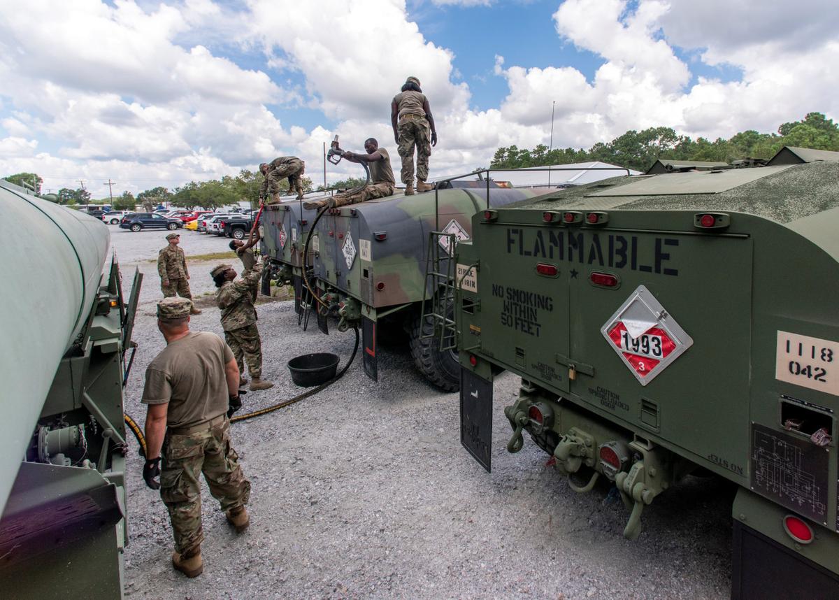 South Carolina National Guard soldiers transfer bulk diesel fuel into tanker trucks for distribution in advance of Hurricane Florence, in North Charleston, South Carolina, on Sept. 10, 2018. (U.S. Army National Guard/Sgt. Brian Calhoun/Handout via Reuters)