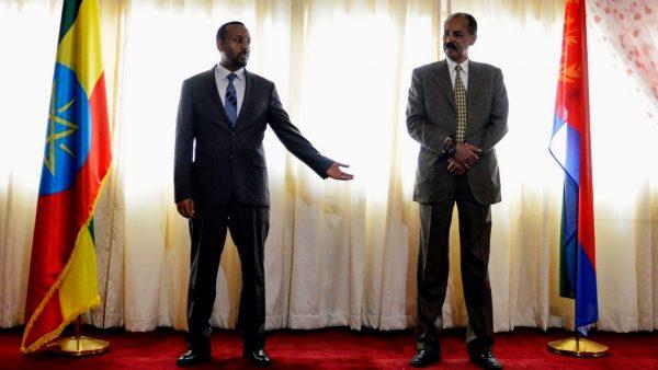 Ethiopian Prime Minister Abiy Ahmed (L) and Eritrean President Isaias Afwerki (R) celebrate the reopening of the Embassy of Eritrea in Ethiopia in Addis Ababa on July 16, 2018. (Photo by Michael Tewelde/AFP/Getty Images)