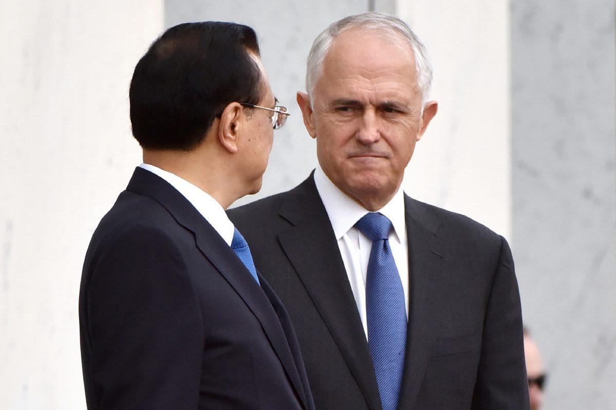 Australia's then-Prime Minister Malcolm Turnbull (R) looks at China's Premier Li Keqiang as they prepare to leave the ceremonial welcome at Parliament House in Canberra on March 23, 2017. (MARK GRAHAM/AFP/Getty Images)