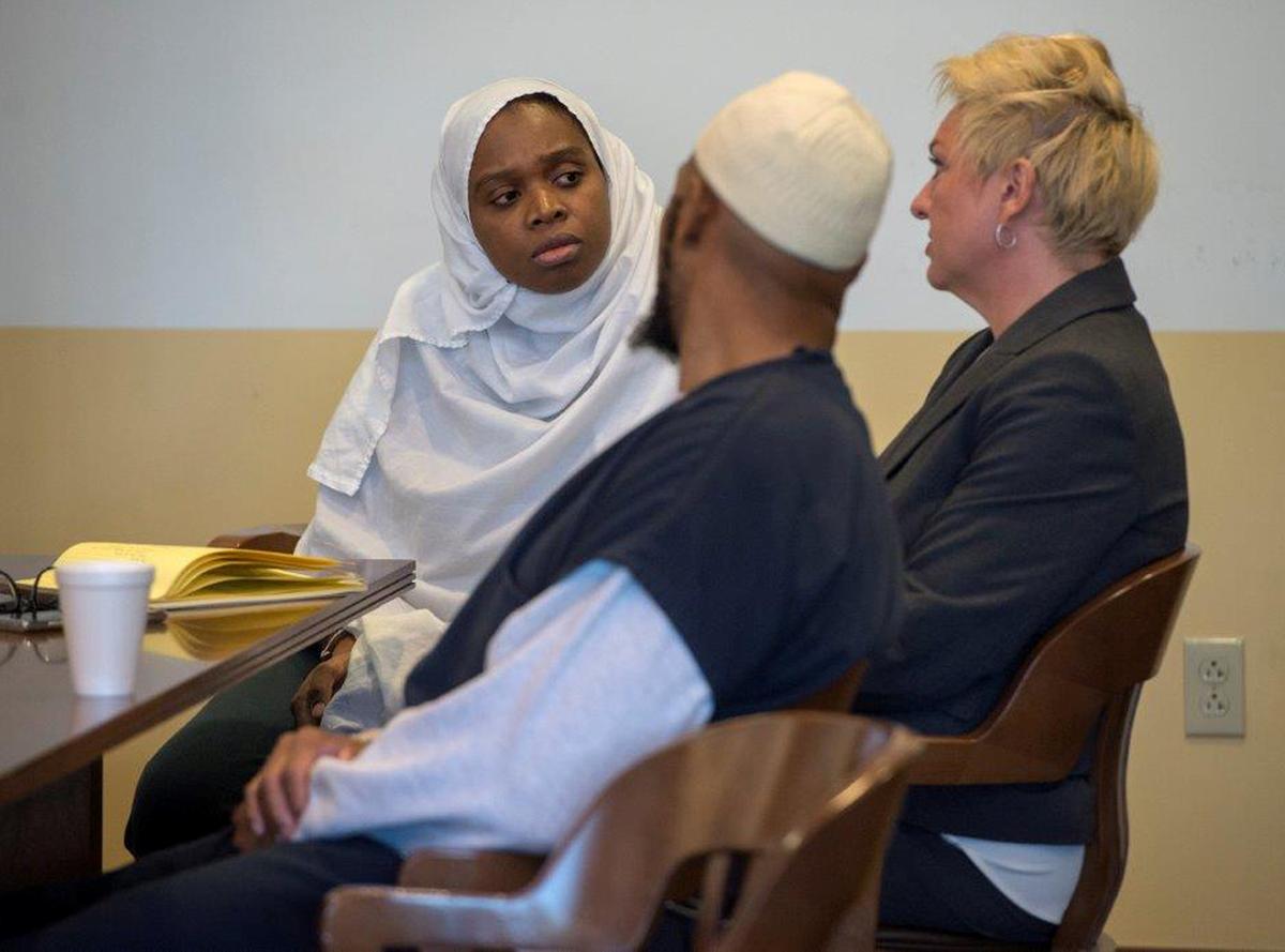 Jany Leveille (L to R) and Siraj Ibn Wahhaj talk to defense lawyer Kelly Golightly during a hearing in Taos District Court in Taos County, N.M., on Aug. 29, 2018. (Eddie Moore/Pool via Reuters)