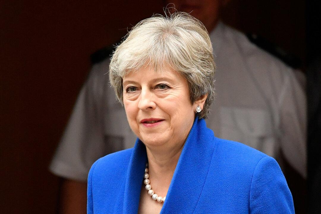 UK PM May Promises Timetable in June for Her Exit Date