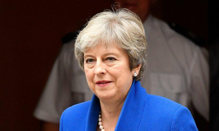 UK PM May Promises Timetable in June for Her Exit Date