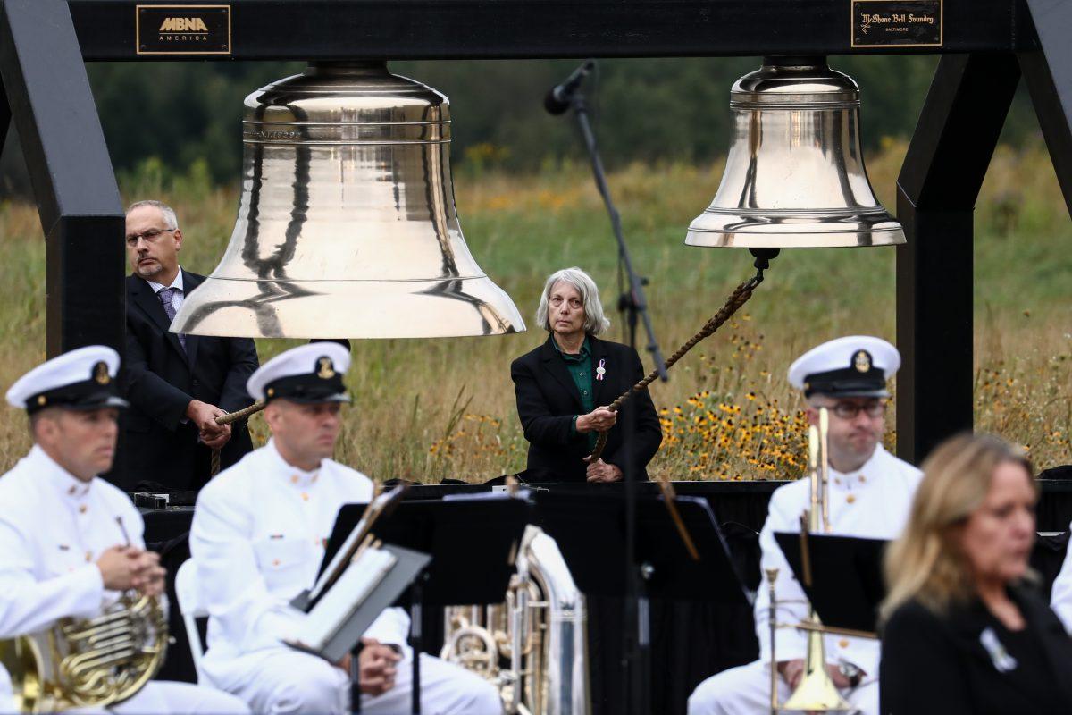 Bells of rememberance are rung as family members of the victims of Flight 93 announce the names of their lost ones at the Flight 93 September 11 Memorial Service in Shanksville, Pa., on Sept. 11, 2018. (Samira Bouaou/The Epoch Times)