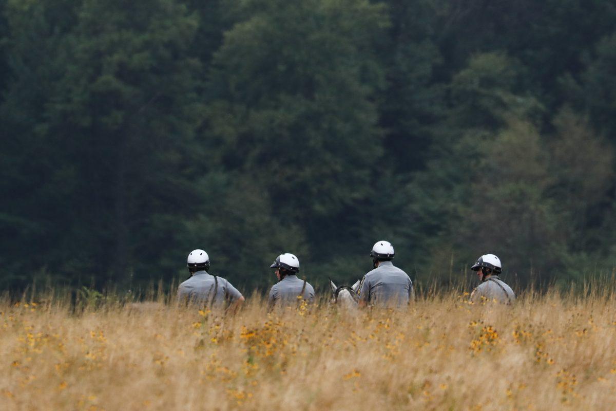 Pennsylvania State Police stand guard at the Flight 93 September 11 Memorial Service in Shanksville, Pa., on Sept. 11, 2018. (Samira Bouaou/The Epoch Times)