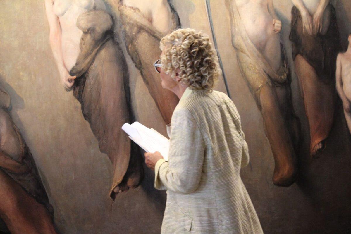 A visitor in front of Odd Nerdrums painting "Five Singing Women" at the opening of the exhibition “It’s about us” at the Krapperup art gallery, on June 30, 2018. (Susanne W. Lamm/The Epoch Times)