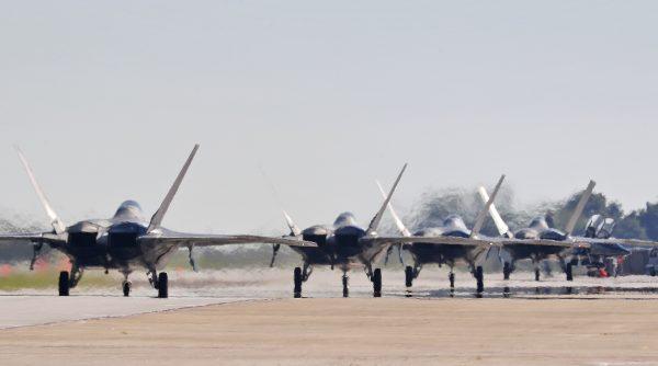 F-22s taxi down the runway as they prepare to depart Langley Air Force Base on Sept. 11, 2018 as Hurricane Florence approaches. T-38 jets and F-22s and about 100 Langley personnel will travel to Rickenbacker Air National Guard Base in Ohio. (AP)