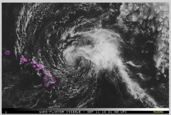 This satellite image made available the National Oceanic and Atmospheric Administration (NOAA) shows Tropical Storm Olivia east of the main islands of Hawaii at 11 a.m. Hawaii time on Sept. 11, 2018. (NOAA via AP)
