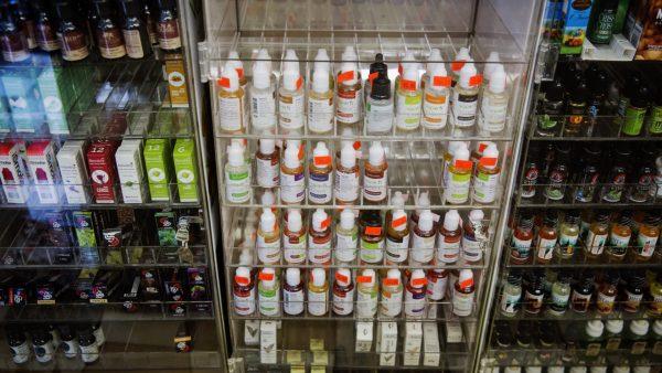 Bottles of flavor packets for e-cigarettes stand displayed in a tobacco shop in N.Y. on June 23, 2015. (Reuters/Lucas Jackson)