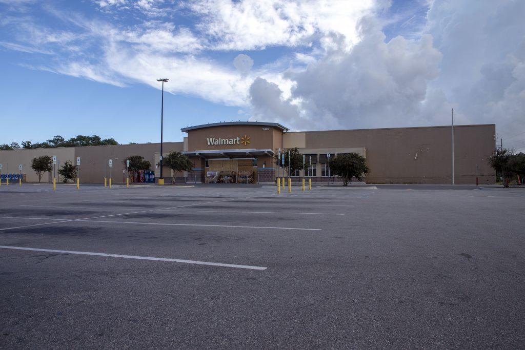 Wood boards and cardboard boxes block the entrance to a deserted Walmart store ahead of Hurricane Florence in Kill Devil Hills in the Outer Banks of North Carolina on Sept. 11, 2018. (ALEX EDELMAN/AFP/Getty Images)