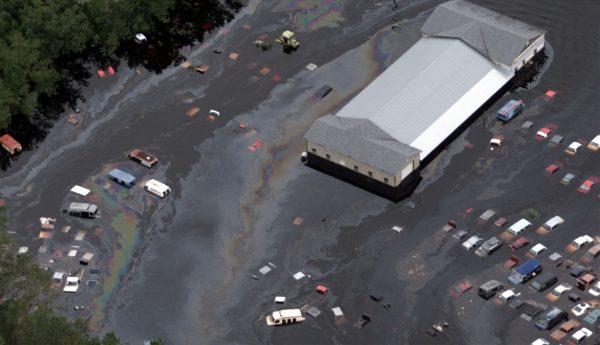 File photo showing motor vehicles in an auto salvage yard just outside Wallace, North Carolina, as they continue to seep fuel and oil in the flood waters spurned by Hurricane Floyd. Sept. 20, 1999. (John Althouse/AFP/Getty Images)
