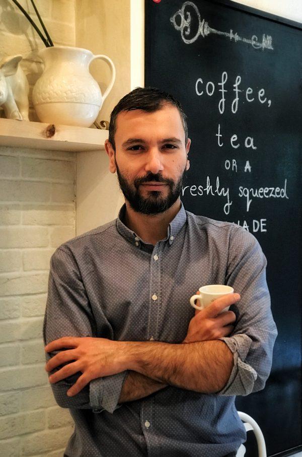 Greek business owner Dimitris Hatzipetrou in his cafe Le Petit Village in Athens on Sept. 7, 2018. (Aris Apostolopoulos/Special to The Epoch Times)