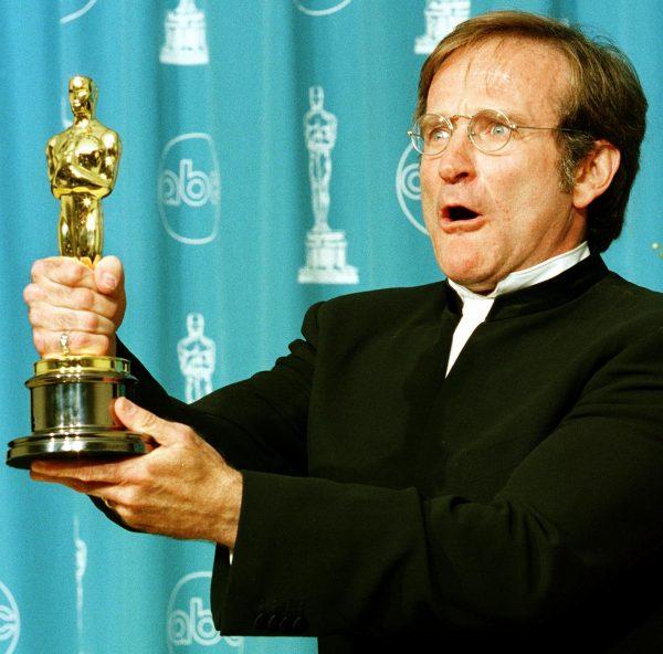 Actor Robin Williams holds the Oscar he won for Best Supporting Actor for his role in "Good Will Hunting" during the 70th Annual Academy Awards in Los Angeles, Calif. on March 23, 1998. (HAL GARB/AFP/Getty Images)