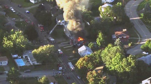 Firefighters battle a raging house fire in Lawrence, Mass, a suburb of Boston, on Sept. 13, 2018. (WCVB via AP)