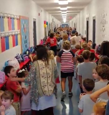 Fifth and sixth graders at Wayne Christian School in Goldsboro, North Carolina sing a rendition of "Eye of the Storm" ahead of Hurricane Florence's landfall, on Sept. 11, 2018. (Chris N Paris Verme via Storyful)
