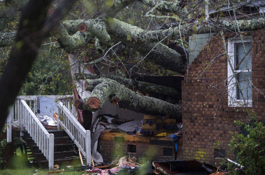 A tree that fell on a house, killing two people, is seen during Hurricane Florence in Wilmington, North Carolina on Sept. 14, 2018. (Andrew Caballero-Reynolds/AFP/Getty Images)