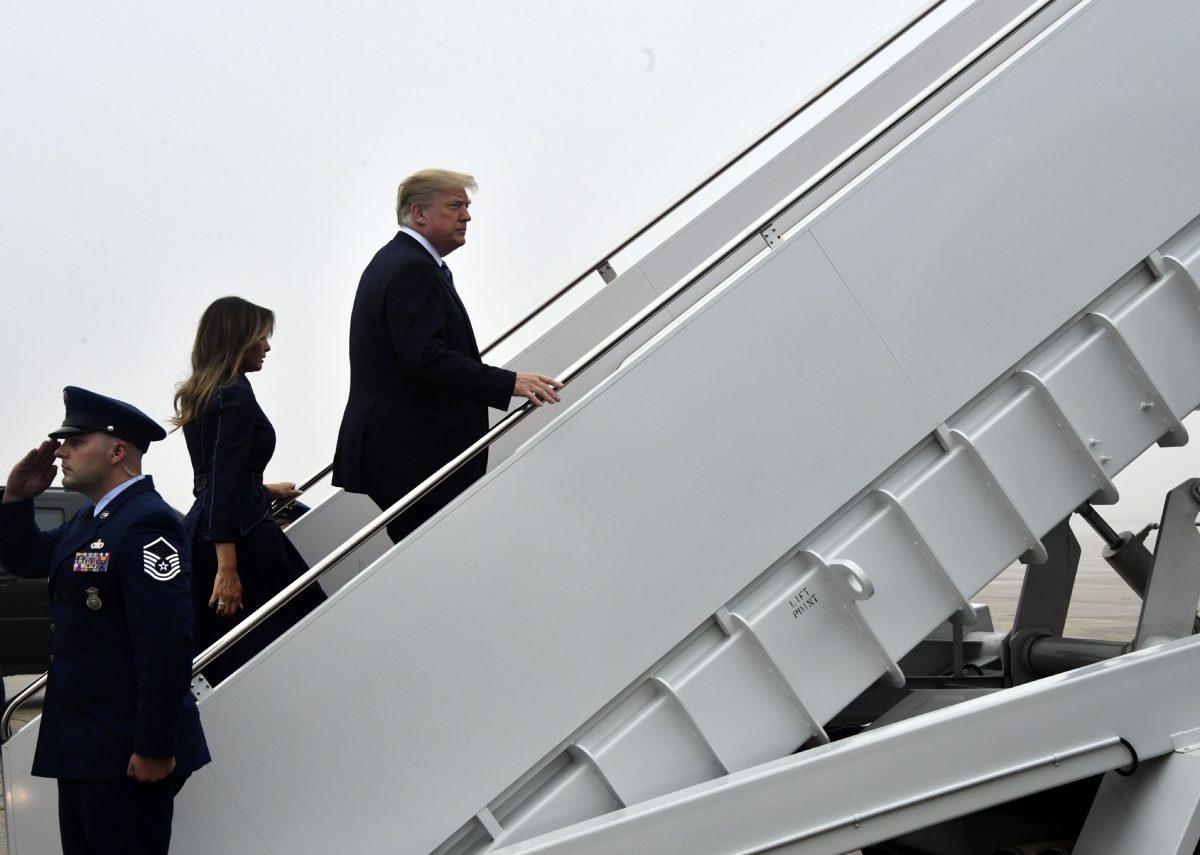 President Donald Trump and First Lady Melania Trump board Air Force One at Andrews Air Force Base, Md., en route to Shanksville, Pa., on Sept. 11, 2018. (Nicholas Kamm / AFP)