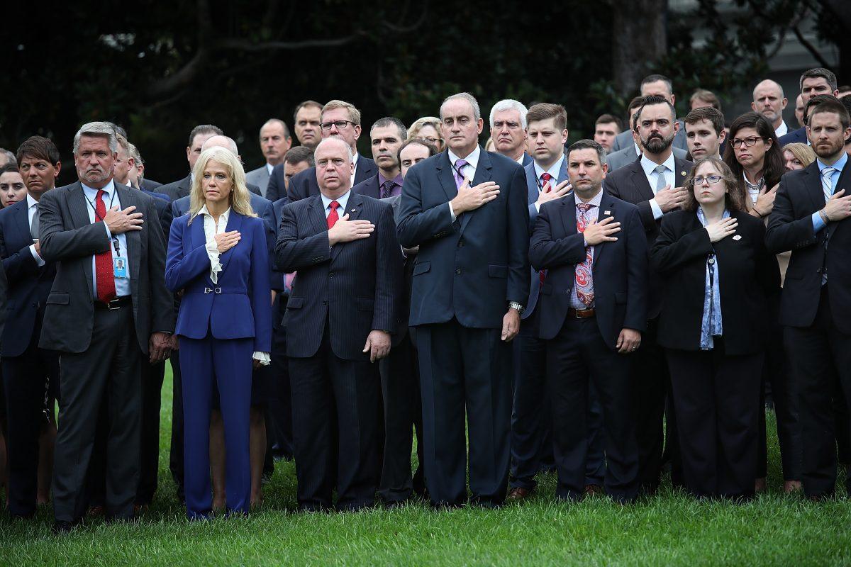 Members of the White House staff observe a moment of silence on the south lawn of the White House at 8:37 a.m., in Washington on Sept. 11, 2018. (Win McNamee/Getty Images)