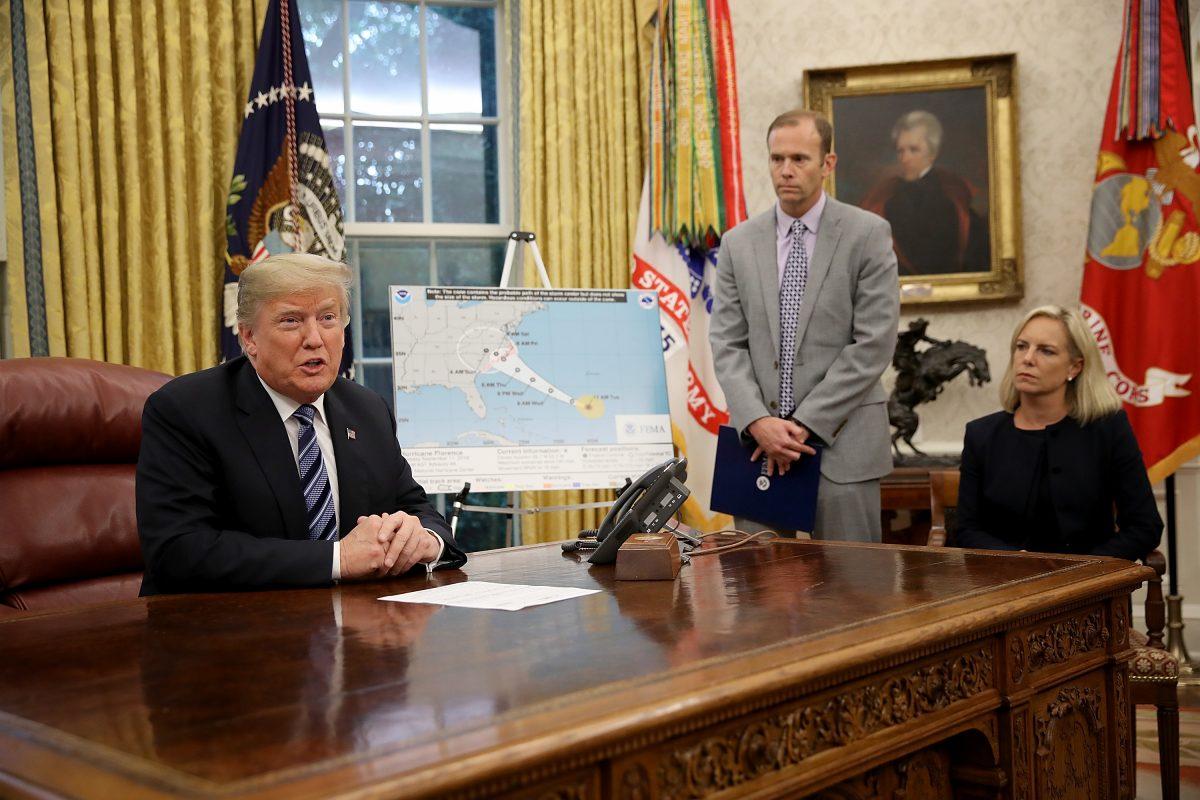 President Donald Trump meets with FEMA Administrator Brock Long (C) and Homeland Security Secretary Kirstjen Nielsen to discuss Hurricane Florence in the Oval Office on Sept. 11, 2018. (Win McNamee/Getty Images)