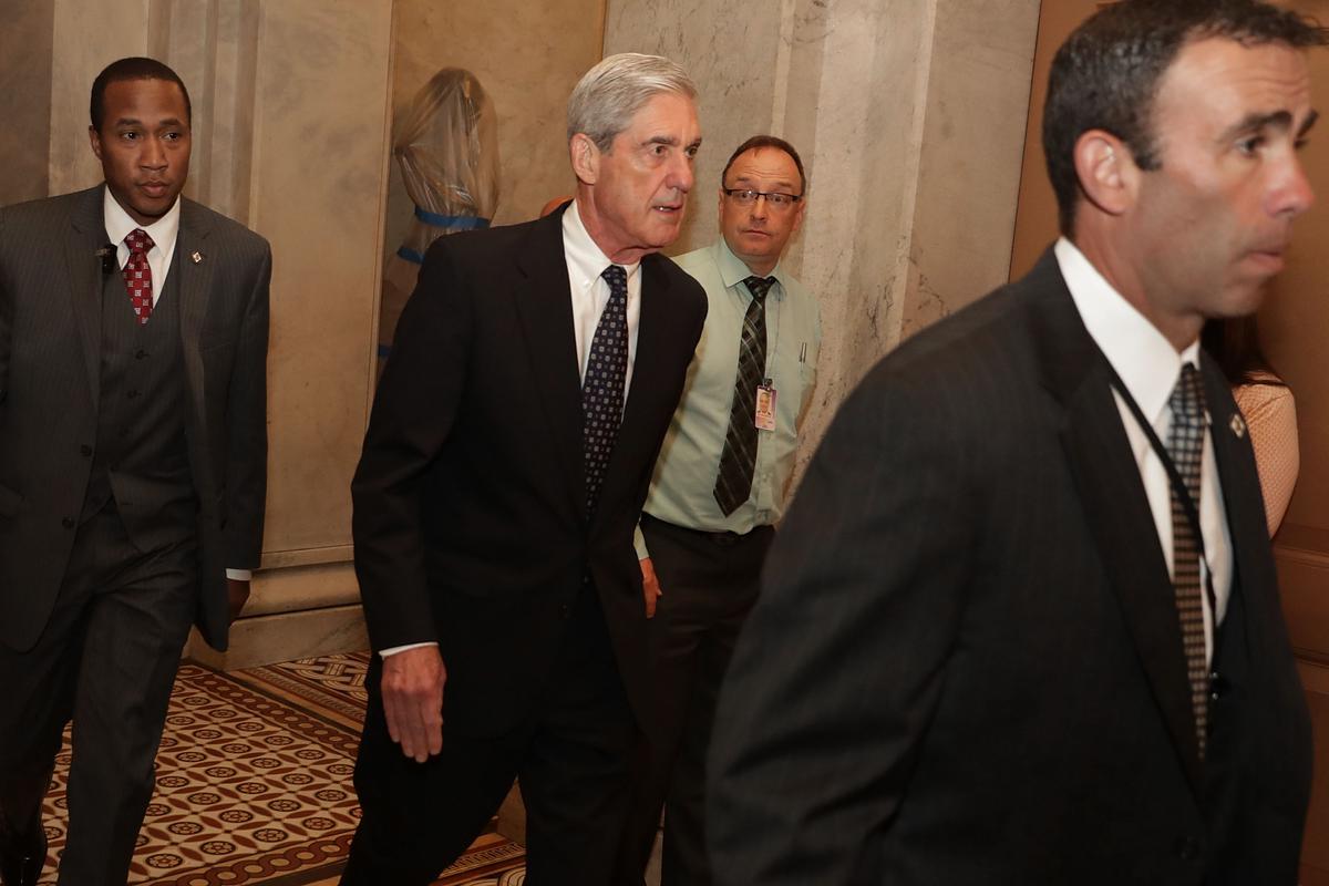 Special counsel Robert Mueller (C) is surrounded by security and staff as he leaves a meeting with senators at the U.S. Capitol June 21, 2017, in Washington. (Chip Somodevilla/Getty Images)