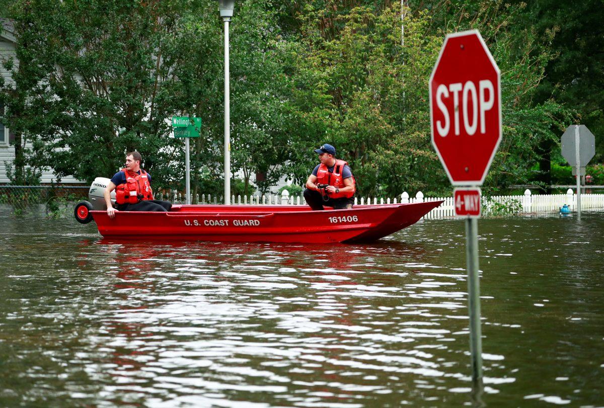 Members of the Coast Guard launch rescue boats into the neighborhood of Mayfair in the flood waters caused by Hurricane Florence in Lumberton, North Carolina, on Sept. 16, 2018. (Jason Miczek/Reuters)
