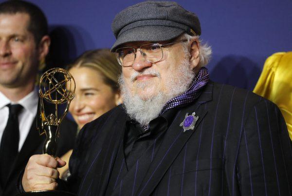 George R. R. Martin poses backstage with the Outstanding Drama Series award for "Game of Thrones." in Los Angeles, Calif., on Sept. 17, 2018. (Mario Anzuoni/Reuters)