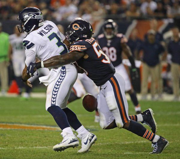 Danny Trevathan #59 of the Chicago Bears strips Russell Wilson #3 of the Seattle Seahawks of the the ball at Soldier Field in Chicago, Illinois on Sept. 17, 2018. (Jonathan Daniel/Getty Images)