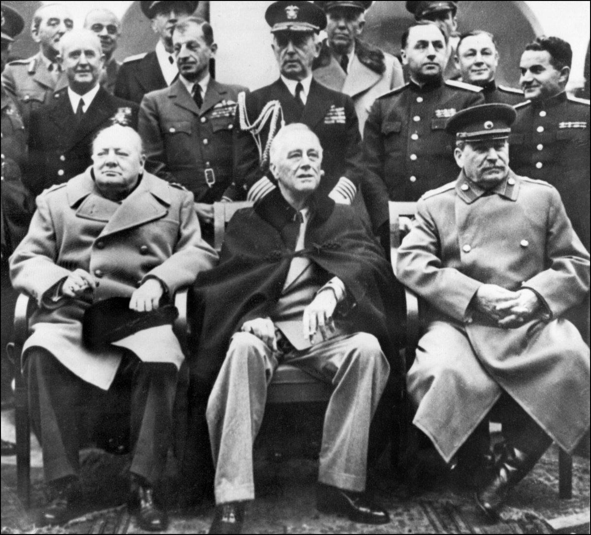 From left to right: British Prime Minister Winston Churchill, U.S President Franklin Delano Roosevelt, and Secretary-general of the Soviet Communist Party Joseph Stalin pose at the start of the Conference of the Allied powers in Yalta, Crimea, on Feb. 4, 1945. (STF/AFP/Getty Images)