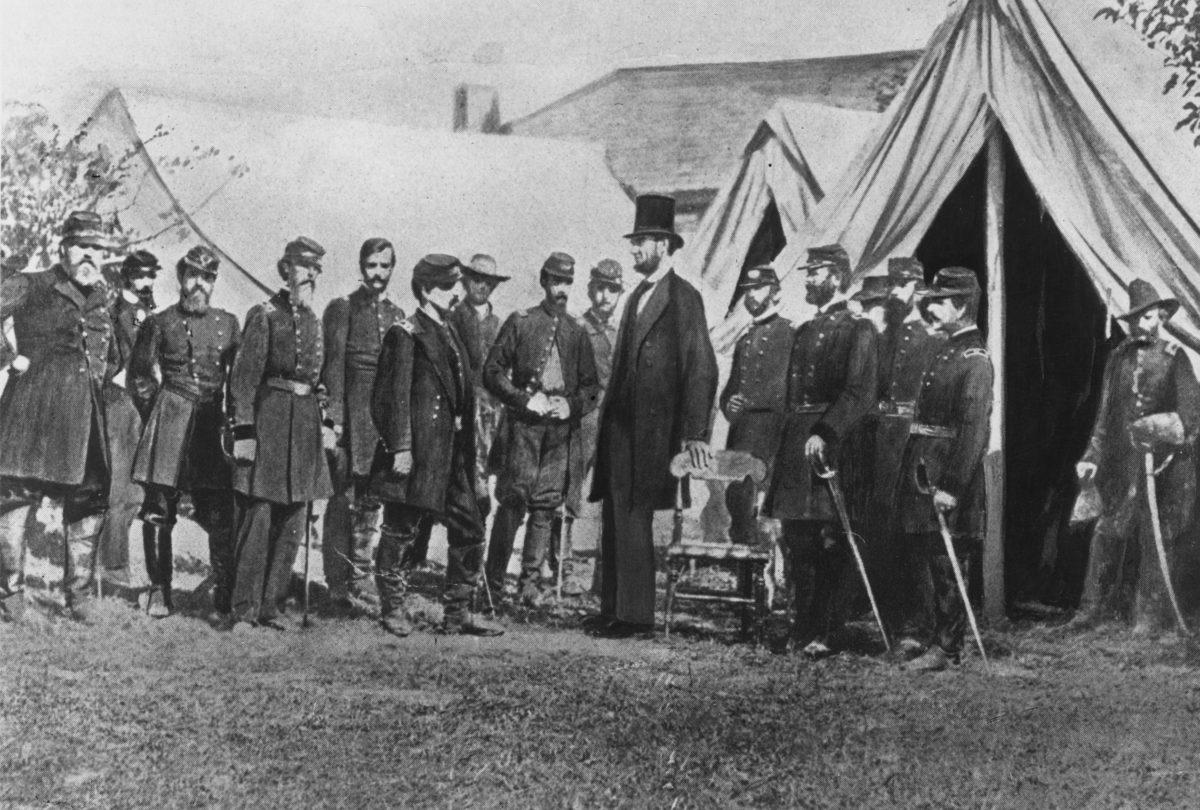 President Abraham Lincoln visits soldiers encamped at the Civil War battlefield of Antietam in Maryland on Oct. 1, 1862. (Rischgitz/Getty Images)