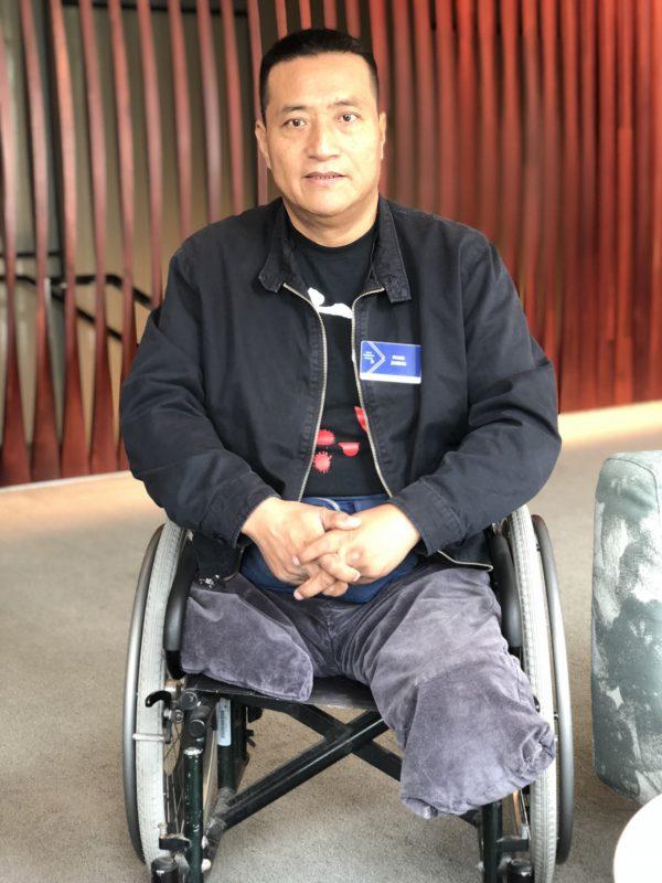 Fang Zheng, 55, whose legs were run over by a tank during the 1989 Tiananmen Square Massacre, prepares to speak at the Oslo Freedom Forum in New York, on Sept. 17, 2018. (Bowen Xiao/The Epoch Times)