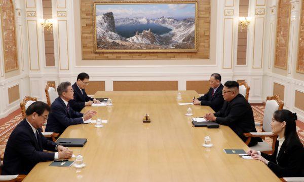 South Korean President Moon Jae-in talks with North Korean leader Kim Jong Un during their meeting in Pyongyang, North Korea, on Sept. 18, 2018. (Pyeongyang Press Corps/Pool via Reuters)