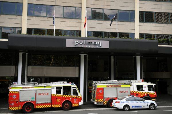 Emergency service workers at the scene of a chemical leak at the Pullman Hotel in Sydney, Australia on Sept. 19, 2018. (AAP/Joel Carrett/Reuters)