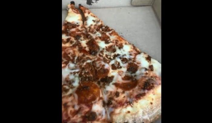 Video: Woman Shows Alleged Maggots on Slice of Pizza