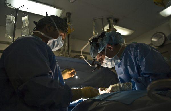 Doctors perform surgery on a patient. (Pxhere)