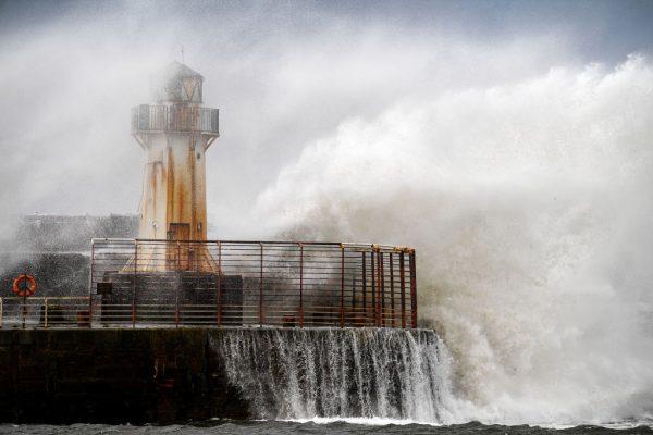 Waves crash against the harbor wall as Storm Ali hits land on Sept. 19, 2018, in Ardrossan, Scotland. (Jeff J Mitchell/Getty Images)