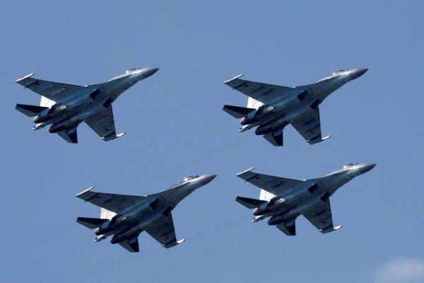 Sukhoi Su-35 multi-role fighters of the Sokoly Rossii (Falcons of Russia) aerobatic team fly in formation during a demonstration flight at the MAKS 2017 air show in Zhukovsky, outside Moscow, Russia on July 21, 2017. (REUTERS/Sergei Karpukhin/File Photo)