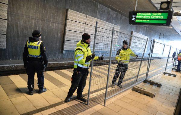 A temporary fence is erected between domestic and international tracks at Hyllie train station in Malmo, Sweden, on Jan. 3, 2016, to prevent illegal migrants from entering Sweden. (Johan Nilsson/TT/AFP/Getty Images)