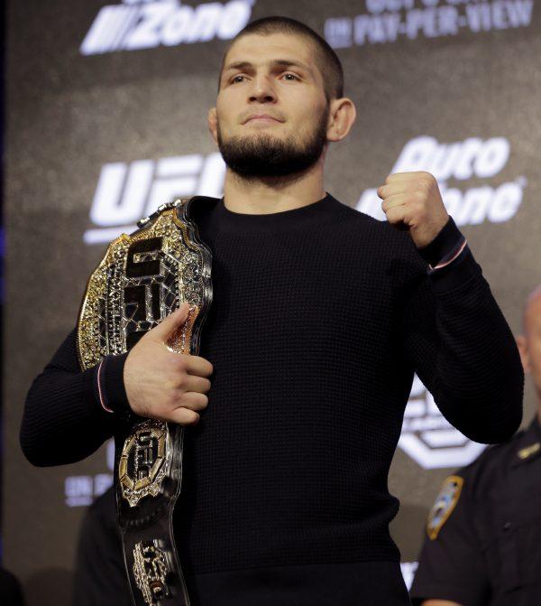 Khabib Nurmagomedov, undefeated in the ring, poses for a picture during a news conference in New York, on Sept. 20, 2018. (AP Photo/Seth Wenig)