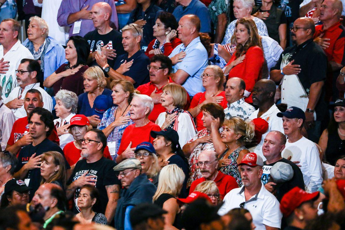 The crowd recites the Pledge of Allegiance at President Donald Trump’s Make America Great Again rally in Las Vegas, Nev., Sept. 20, 2018. (Charlotte Cuthbertson/The Epoch Times)
