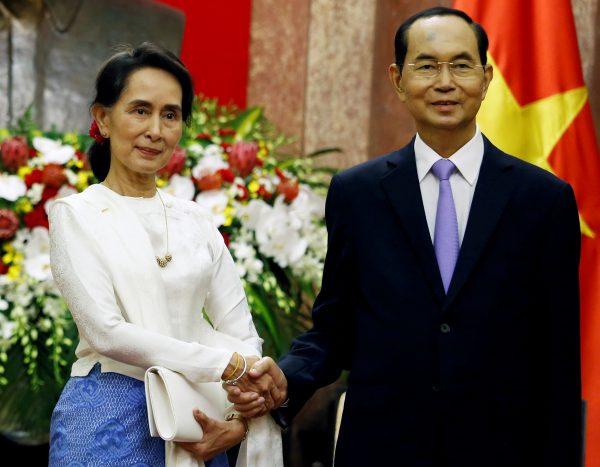 Myanmar's State Counsellor Aung San Suu Kyi (L) meets Vietnam's President Tran Dai Quang at the Presidential Palace during the World Economic Forum on ASEAN in Hanoi, Vietnam, on Sept. 13, 2018. (Kham/Pool/Reuters)
