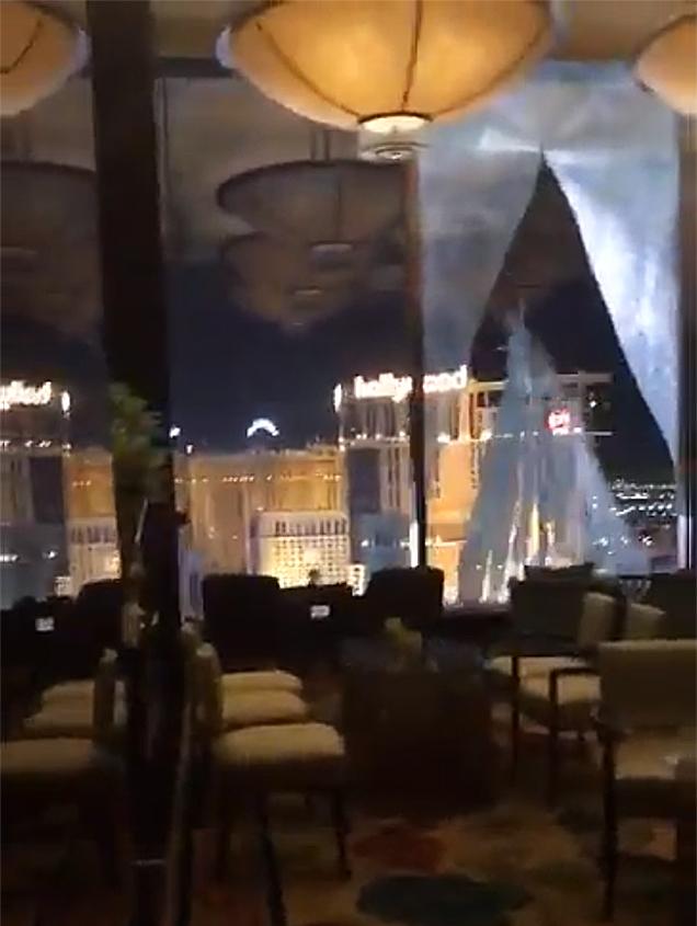 The bottom of the window of the 23rd-floorSky Lobby of the Waldorf Astoria Hotel burst out first. (Screenshot/Crystal Schenkel via Storyful)