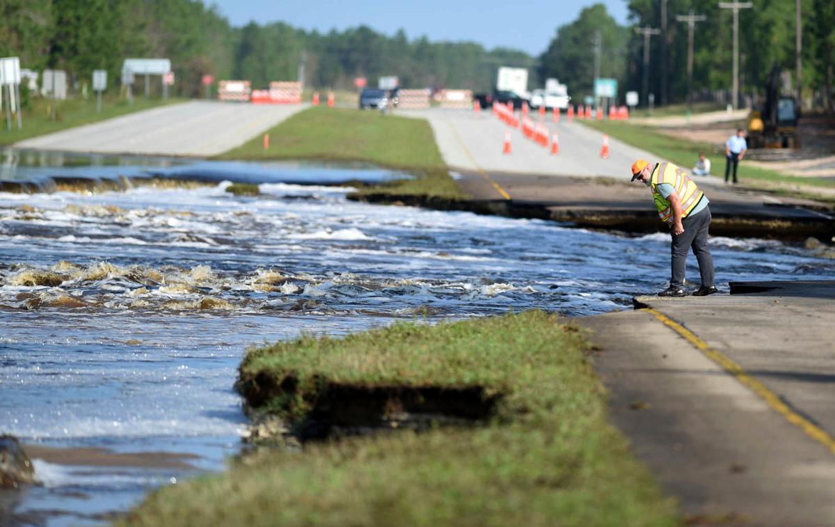 Flooding from Sutton Lake has washed away part of U.S. 421 in New Hanover County just south of the Pender County line in Wilmington, N.C., Sept. 21, 2018. (Matt Born /The Star-News via AP)