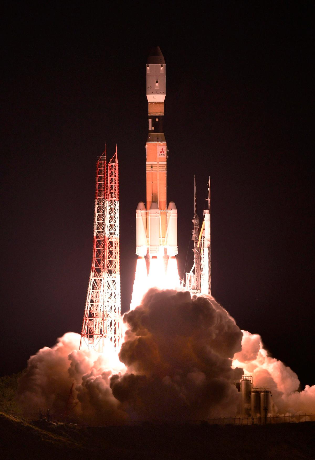 An H-2B rocket carrying the Kounotori 7 cargo spacecraft lifts off from Tanegashima Space Center in the southwestern Japan prefecture of Kagoshima, early Sept. 23, 2018. The unmanned Japanese space capsule is heading to the International Space Station with 5,500 kilograms (12,000 pounds) of cargo including food, experiments and new batteries. (By Kyodo News/AP)