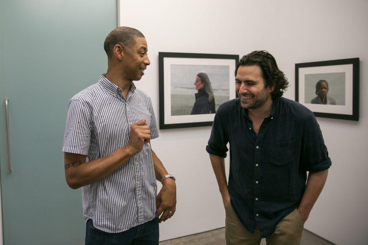 Mario A. Robinson (L) and oil painter Jordan Sokol celebrate at the opening of Robinson's show at the Bernarducci Gallery in the Chelsea district of New York, on Sept. 6, 2018. (Milene Fernandez/The Epoch Times)