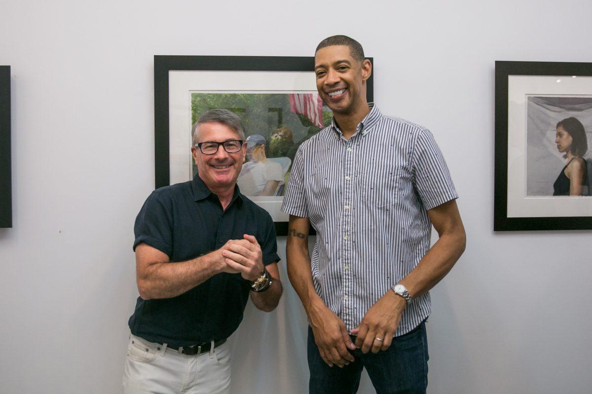 Art dealer Frank Bernarducci (L) and artist Mario A. Robinson pose for a photo during the opening of the exhibition of Robinson's work at the Bernarducci Gallery in the Chelsea district of New York, on Sept. 6, 2018. (Milene Fernandez/The Epoch Times)